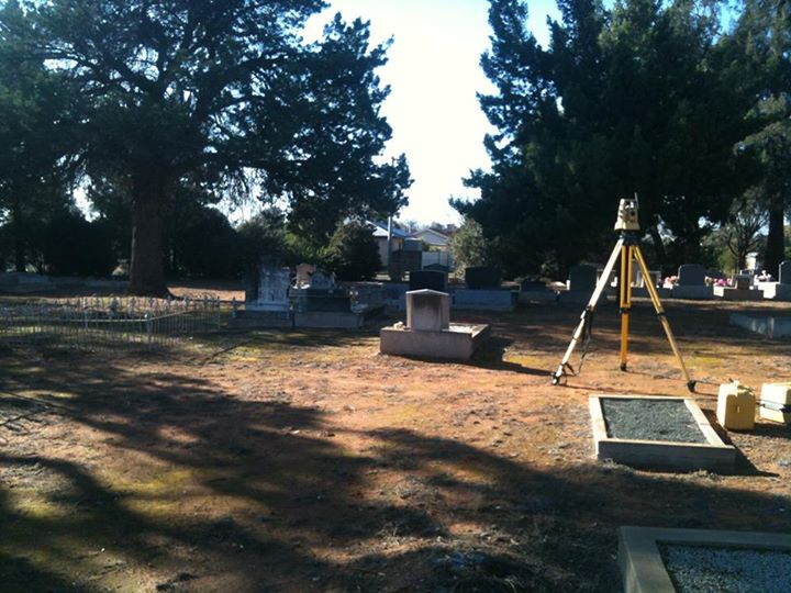 Hunter Geophysics use Topcon and Leica robotic total stations and RTK GPS systems to map cemeteries. This photo shows a Topcon total station on a tripod in a cemetery in northern Victoria.